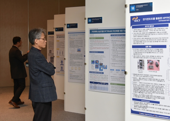 people looking at research poster